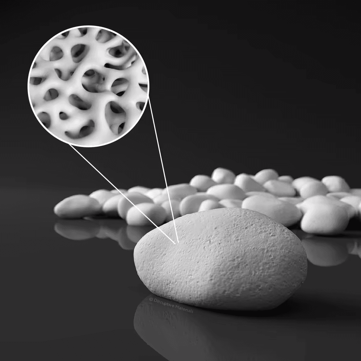 A white Upsalite® pebble with a magnified circle showing its sponge-like network of internal pores
